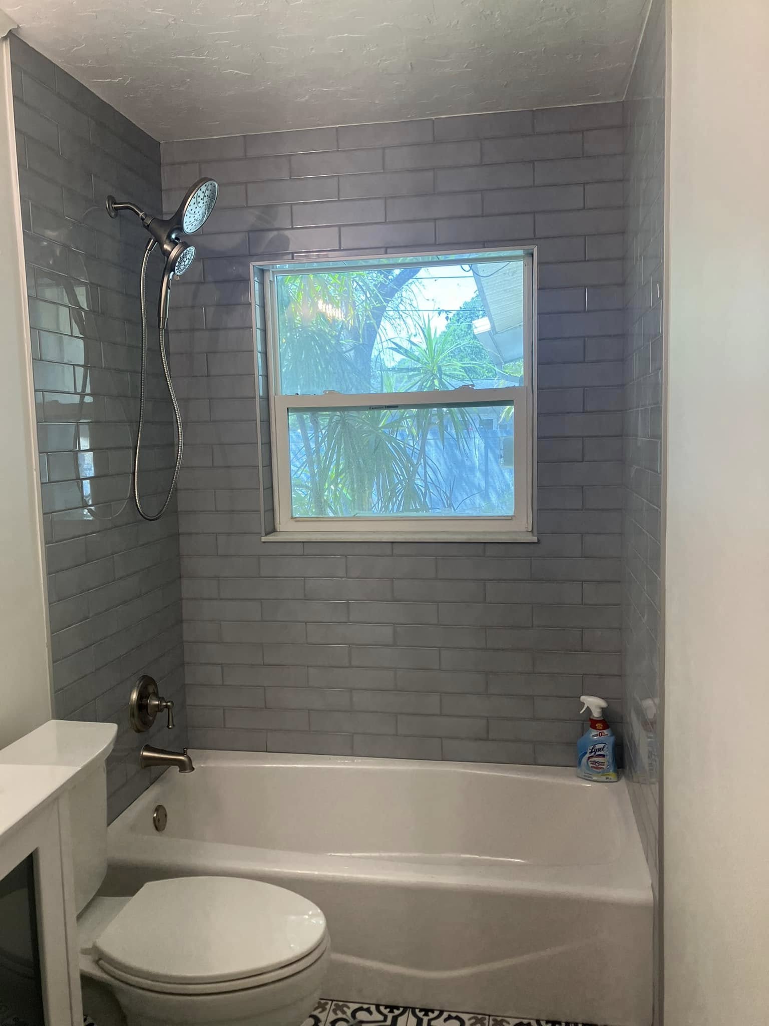 Bathroom remodel with gray tile