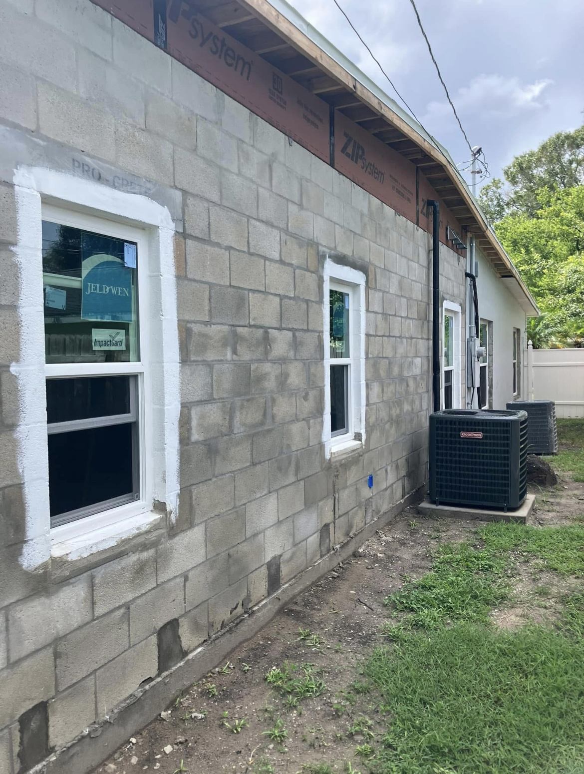 Hurricane impact window installation on a concrete block home in Pinellas County